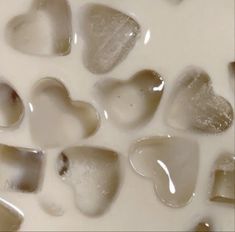 some brown and white hearts are in milk