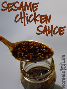 sesame chicken sauce in a glass jar with a spoon full of it and the words sesame chicken sauce on top