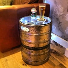 a wooden barrel sitting on top of a table