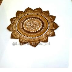 an intricately designed wooden wall hanging decoration