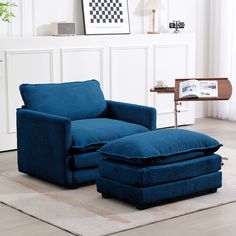 a blue chair and ottoman in a living room