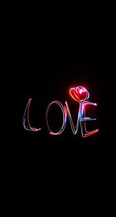 the word love is made up of neon lights