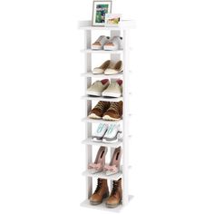 a white shoe rack with four pairs of shoes