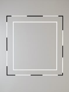 a white square with black lines in the middle on a gray background, as if it were an art work