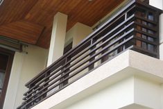 the balcony railing is made of wood and metal