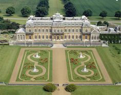 an aerial view of a large palace with gardens