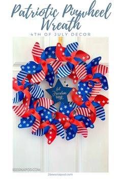 patriotic wreath with red, white and blue streamers on the front door for fourth of july