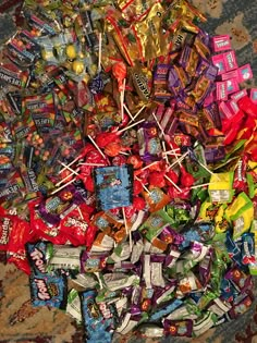 a pile of candy sitting on top of a carpet