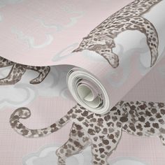 a pink and brown wallpaper with an animal print on it's side,