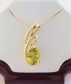 Peridot pendant with chain.  Details: Weight: 2.5 grams Primary stone: Peridot Shape: Pear Chain Length: 18" Metal: 14k Yellow Gold Condition: Brand new! PACKAGING: Each item comes in a jewelry box and wrapped beautifully as a gift. If you would like us to include a gift note in the parcel, please leave us a message with your order about the content of the note. We would love to prepare for you. CUSTOM ORDERS: We welcome all kinds of custom orders. Please reach out to us for any information you Peridot Pendant, Pendant With Chain, New Packaging, Chain Lengths, Chain Length, Online Jewelry, Precious Metals, Pendant Necklaces, Custom Orders