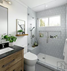 a bathroom with a sink, toilet and shower in it's own area next to a window