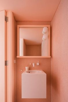 an instagram photo of a bathroom with pink walls