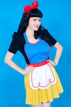 a woman in a snow queen costume posing for the camera with her hands on her hips