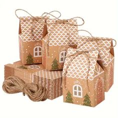 brown paper bags with trees on them and twine wrapped around the top one bag