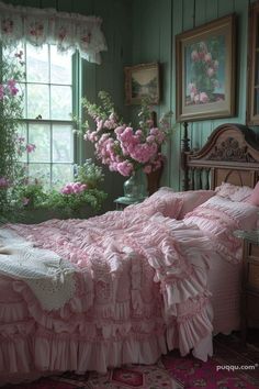 a bed with pink ruffled bedspread in a green room next to a window