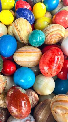 many different colored marbles are stacked on top of each other in the same pattern