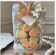 a bag filled with carrots and cookies on top of a table