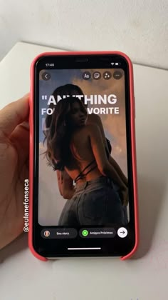 someone is holding up their cell phone to show the screen with an ad on it