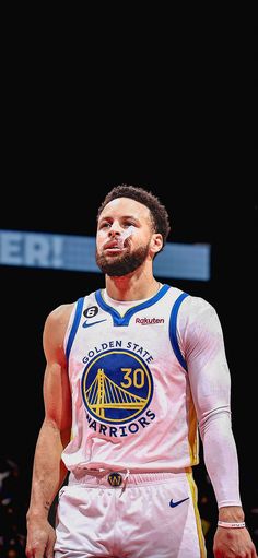 the golden state warriors'stephen curry looks on during an exhibition game against the denver nuggies