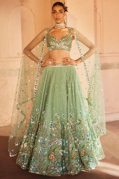 Featuring a soft green lehenga in net and silk base with sequins, metallic and zardosi embroidery. It is paired with a matching blouse and a net dupatta. . #perniaspopupshop #whatiworewastrending #ppuslove #lehengaset #indianattire #ethnic Indian Wedding Dress Traditional, Lehenga Silk, Guest Ideas, Embroidered Birds, Asian Clothing, Green Lehenga, Muted Green, Vacuum Storage