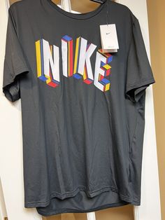 NEW MENS or Unisex size Large NIKE black short Sleeve Dri Fit training polyester blend fabric. Machine washable. Nike logo graphic on the front. Standard fit. New with tags. Adult Size Large Tee T Shirt NWT From a smoke free environment. We ship globally. No returns. Black Sports T-shirt With Graphic Design, Nike Black T-shirt For Sports Season, Black Sporty T-shirt With Athletic Fit, Dri-fit Graphic Print T-shirt For Sportswear, Sports Season Dri-fit Graphic T-shirt, Dri-fit Graphic Print T-shirt For Sports, Sporty Black T-shirt With Logo Print, Nike Sporty Black T-shirt, Sporty Graphic T-shirt For Sports