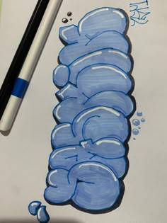 a drawing of a blue caterpillar on paper