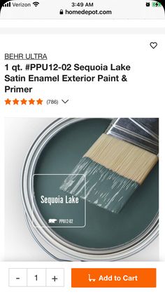 a paint can with a brush on top of it