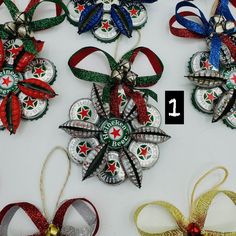 six christmas ornaments with ribbons and bows on them