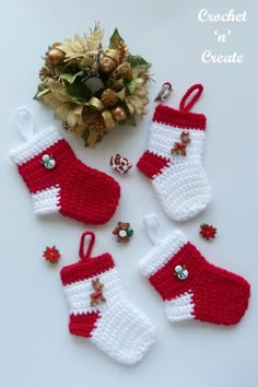 crocheted christmas stockings and ornaments on a table