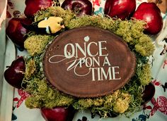 an apple wreath with the words once upon a time written on it