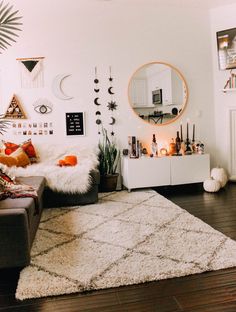 a living room filled with lots of furniture and decor