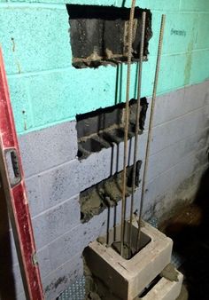 a brick wall that has been torn down and is being used as a fire escape