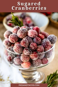 sugared cranberries in a glass bowl with rosemary sprigs on the side