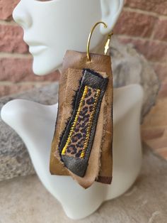 Handmade brown leather earrings with animal print accents Chic Brown Dangle Jewelry, Trendy Brown Earrings, Handmade Leather Brown Earrings, Handmade Brown Leather Earrings, Chic Brown Earrings For Everyday Wear, Chic Brown Everyday Earrings, Chic Everyday Brown Earrings, Handmade Brown Earrings For Everyday Use, Unique Brown Hoop Earrings For Gift