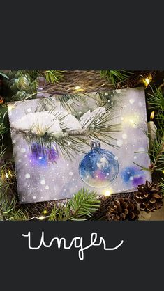 an ornament hanging from a christmas tree next to pine cones and evergreen branches