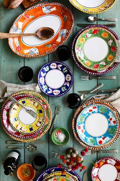 colorful plates and utensils laid out on a table