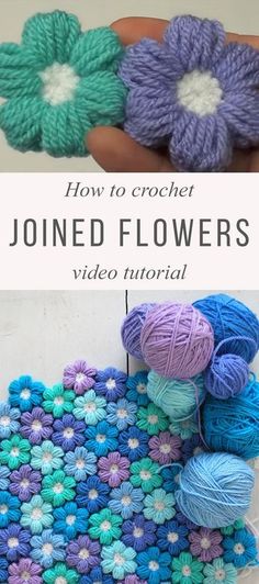 crocheted flowers are shown with yarn on the ground and in front of them