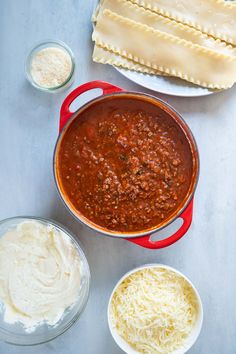 the ingredients to make lasagna are shown in bowls