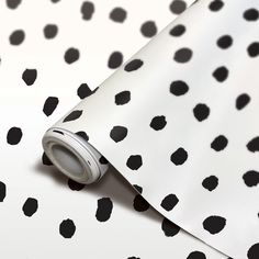 a roll of black and white polka dot paper