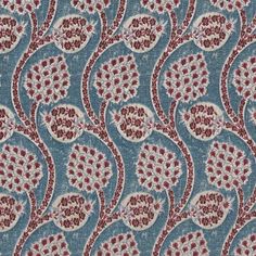 a blue and red fabric with an intricate design