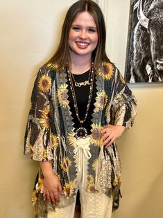 Get ready to turn heads with our Blowing Sunflower Lace Duster! The all-lace design, 3/4 sleeves, and unique sunflower print make this duster stand out in any crowd. With a hi-low hem and black and cream lace, it's the perfect versatile addition to any wardrobe. Cardigan or duster? It's up to you! Lace Duster, Sunflower Print, Glitz And Glam, Cream Lace, Plus Dresses, Lace Design, Bootie Boots, Boho Fashion, Sunflower