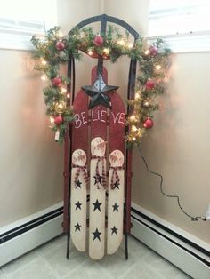 a sleigh decorated with christmas decorations and lights