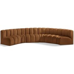 a large brown sectional couch sitting on top of a white floor