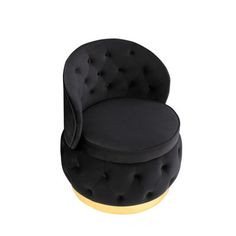 an upholstered black chair with gold accents