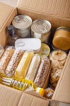 an open cardboard box filled with food and drinks