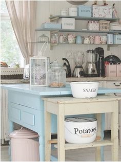 a kitchen island with pots and pans on it