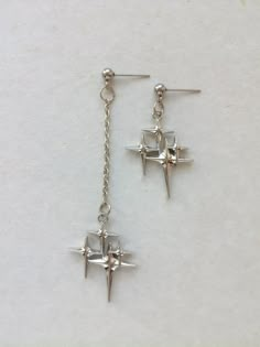 The earrings are adorned with a small star-shaped pendant. The earrings are fastened with stainless steel studs. Earring length - 7.0 cm (2.7 inches) Earrings are packed in a gift box RECOMMENDATIONS FOR CARE: Do not wet, do not drop, and store in a dark box! - Remove jewelry before exercising, swimming, showering and sleeping. - Avoid contact with moisture such as make-up, moisturizer, lotion, perfume and hairspray. - Store your jewelry in a box or pouch after use. Girlfriend Earrings, Earrings Grunge, Rock Y2k, Grunge Earrings, Silver Star Earrings, Celestial Earrings, Gothic Earrings, Funky Jewelry, Grunge Goth