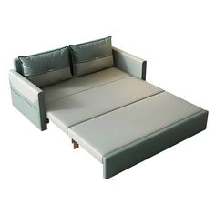 a sofa bed with two pillows on it's back and one arm folded open