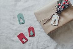 presents wrapped in brown paper and tied with twine on top of a white tablecloth