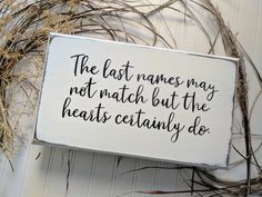 a sign that says the last names may not match but the hearts certainly do on it